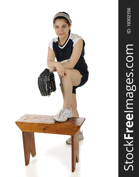 Portrait of a pretty young teen in her softball uniform. Isolated on white. Portrait of a pretty young teen in her softball uniform. Isolated on white.