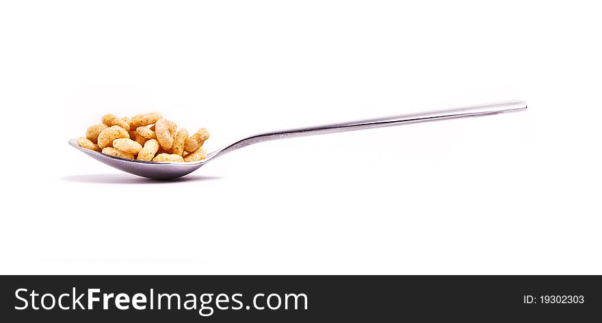 Round cornflakes in a spoon. Round cornflakes in a spoon