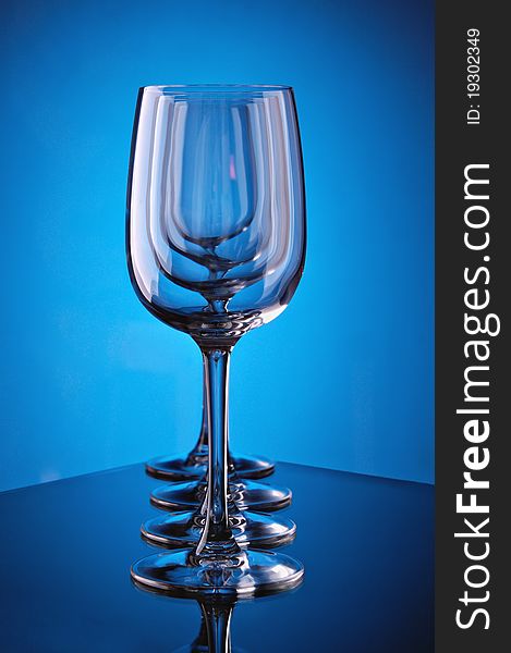 Group of wine glasses on colour a gradient a background