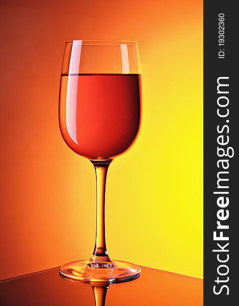 Wine glasses on colour a gradient a background