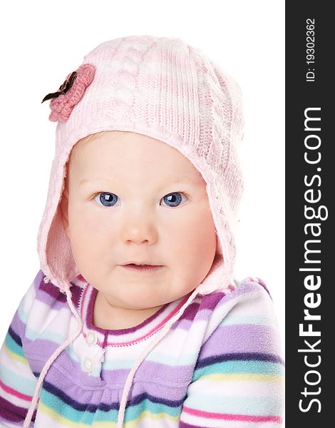 Portrait of cute happy baby girl in funny pink hat isolated on white background