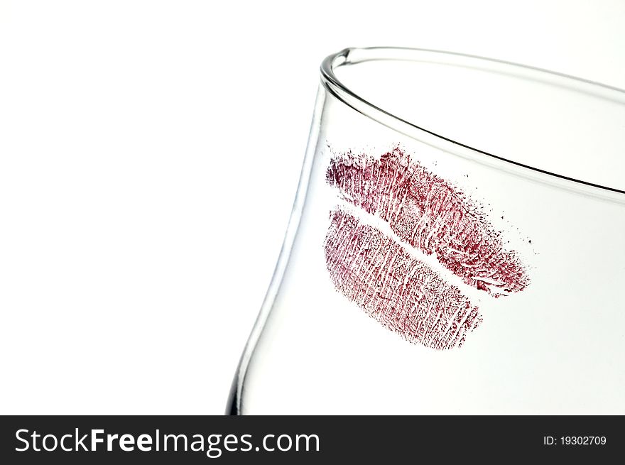 Kiss on glass on thumped background.