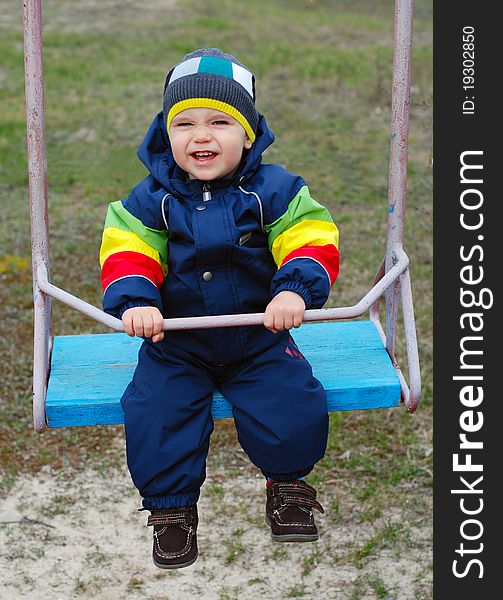 Happy little boy on swing. Happy little boy on swing