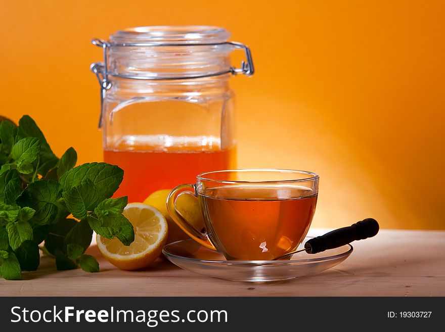 Cup of herbal tea and honey, mint and lemon
