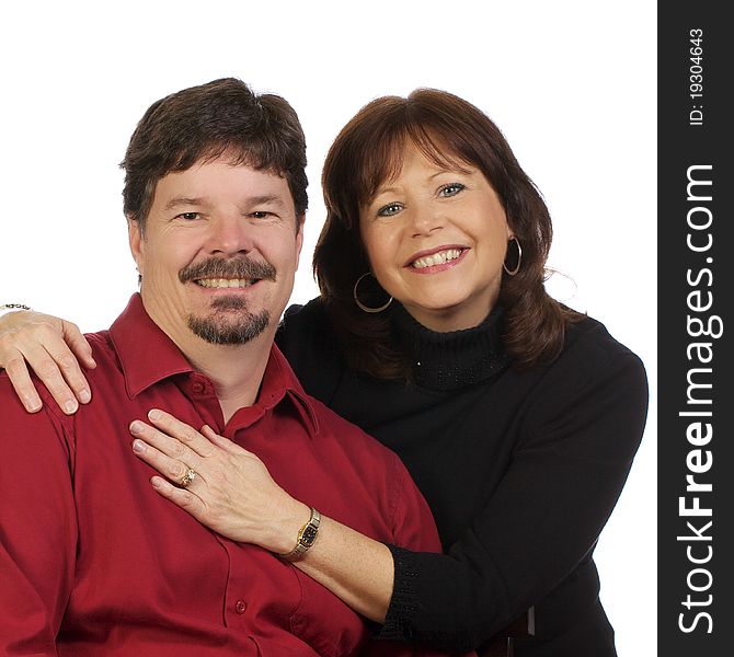 Wife affectionately putting her arms around her husband for a portrait shot. Wife affectionately putting her arms around her husband for a portrait shot.