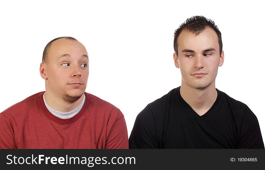 Young men goofing around and being silly for a studio shot. Young men goofing around and being silly for a studio shot