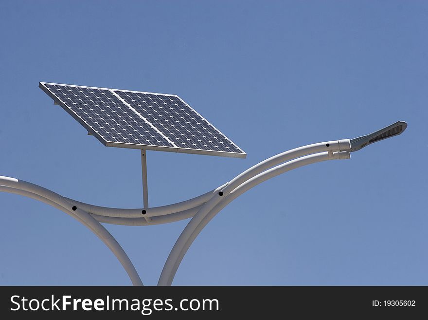 Street light with solar panel energy over blue sky. Street light with solar panel energy over blue sky