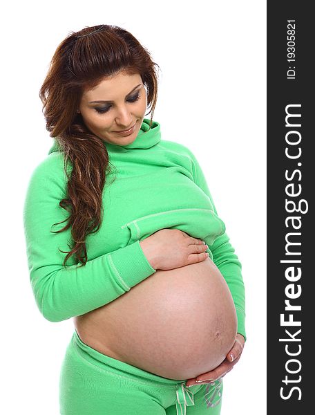 Pregnant Woman standing and holding her belly isolated on white. Pregnant Woman standing and holding her belly isolated on white