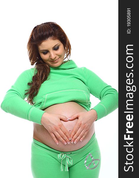 Pregnant woman forming heart shape form on her belly. Pregnant woman forming heart shape form on her belly