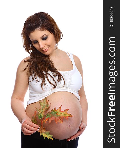 Pregnant woman holding a leaf