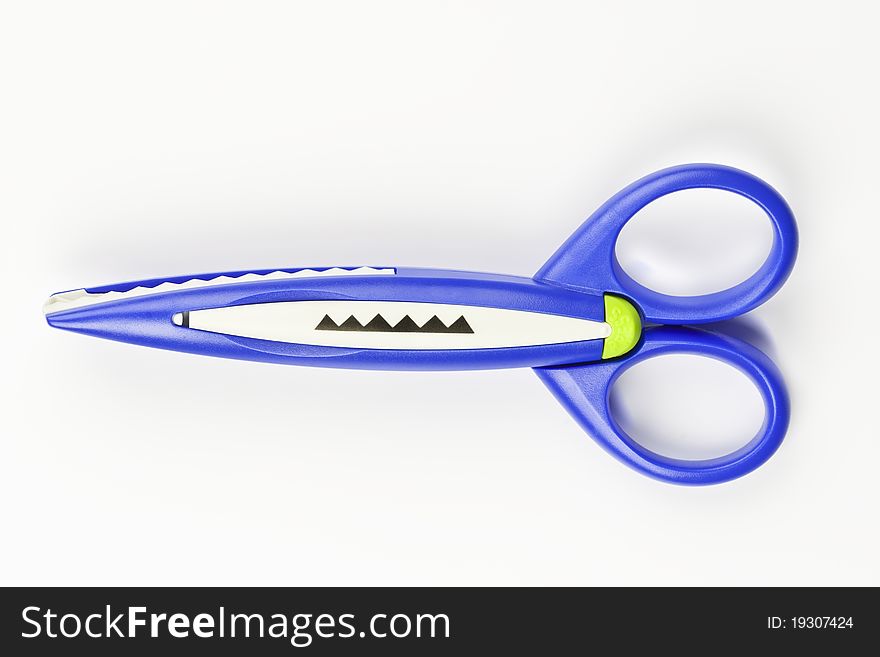 Colorful zigzag scissors on white background