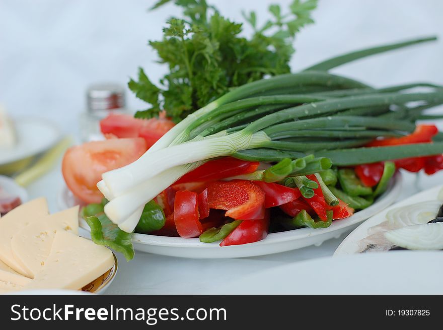 Appetizing vegetable salad on a plate. Appetizing vegetable salad on a plate