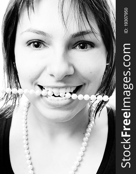 Black and white portrait of a sexy beautiful girl with a necklace. Black and white portrait of a sexy beautiful girl with a necklace