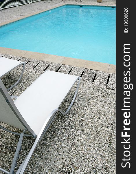 Furniture recliner gardens around a pool