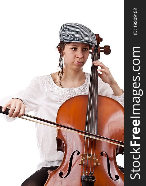 Young cellist siting and playing cello on white background. Young cellist siting and playing cello on white background