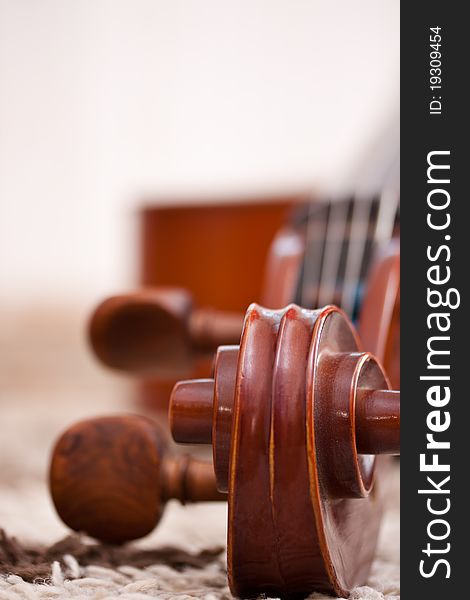 Detail of a classical cello in white background