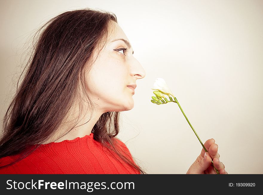 Portrait of a beautiful Girl with a Flower