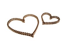 Two Hearts Of Small Metal Beads Stock Photos