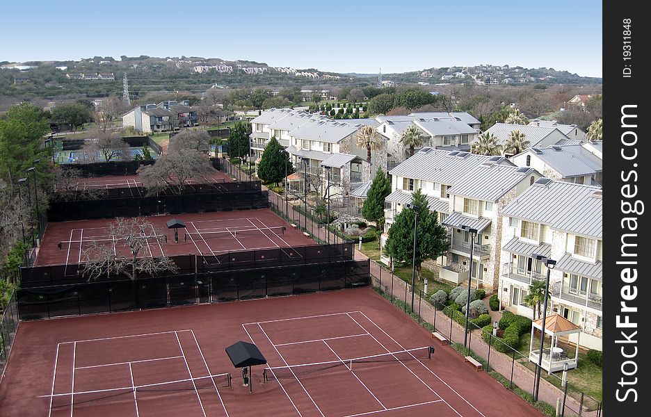 Some tennis courts at a Texas resort with hills in the background. Some tennis courts at a Texas resort with hills in the background.