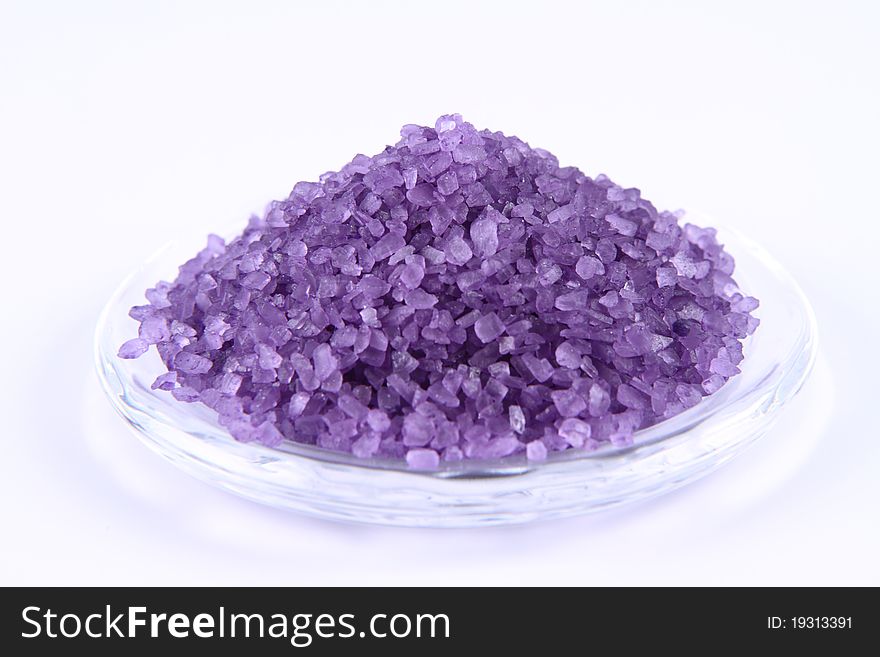 Lavender spa salt on a white background