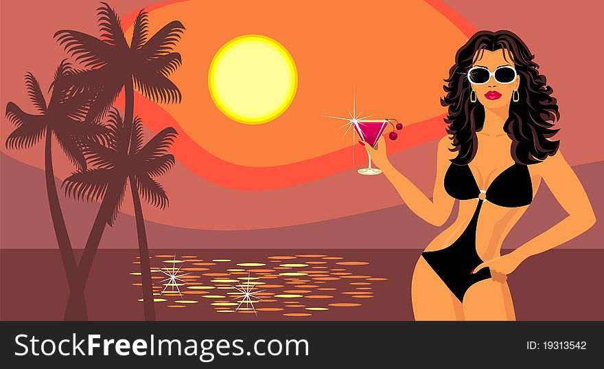 Girl with a cocktail on the beach.