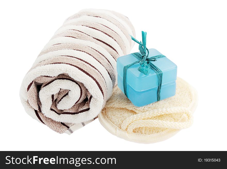Bath equipment - washed, washcloth, towel on the white