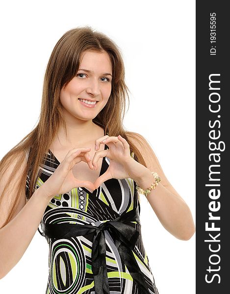 Young girl showing heart with her fingers. Isolated on white background