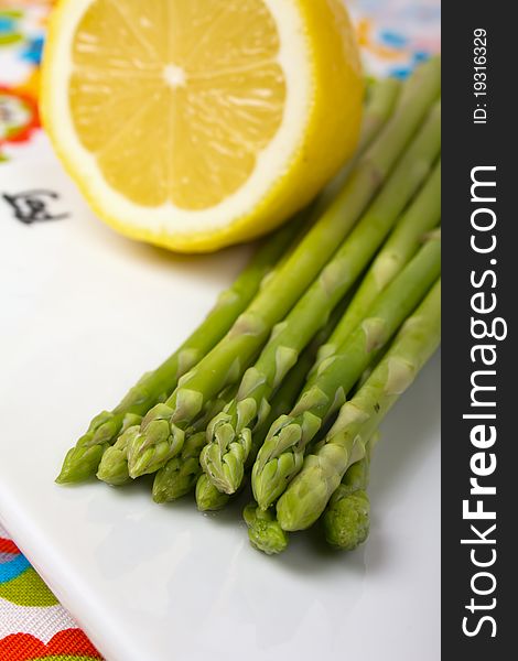 Green asparagus with lemon. close up view