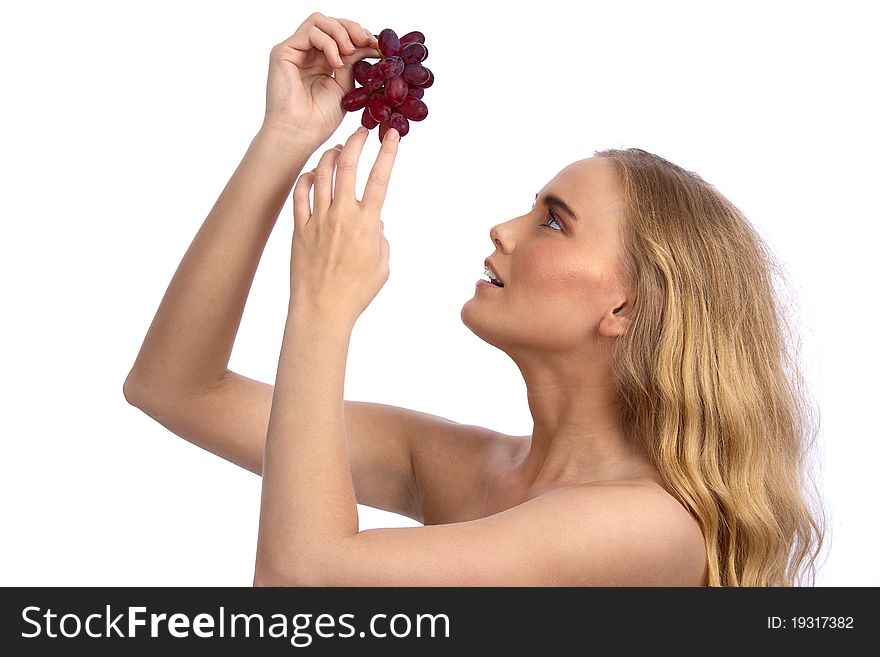Sexy caucasian woman holding red grapes