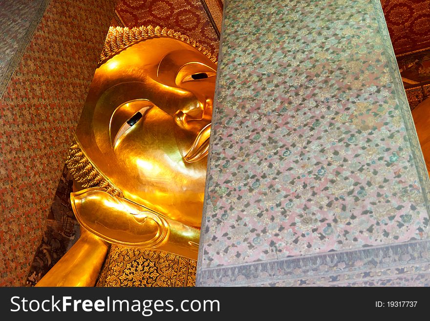 Closed up face of huge sleeping Buddha, Bangkok, Thailand