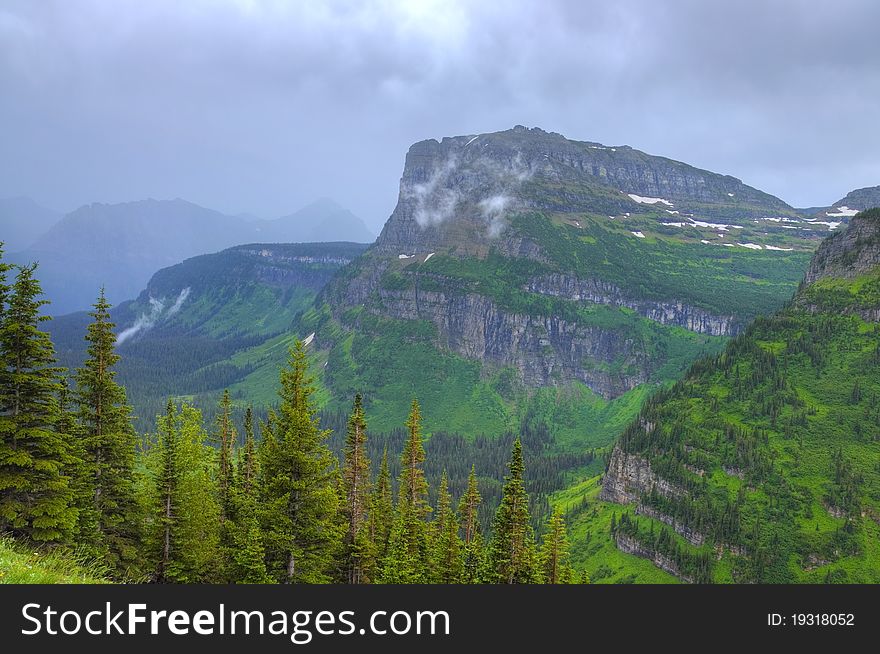 HDR of misty mountain scene in Glacier National Park, Montana, USA