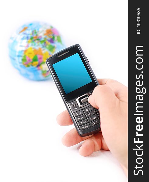 Hand holding a mobile phone and globe on white background. Hand holding a mobile phone and globe on white background