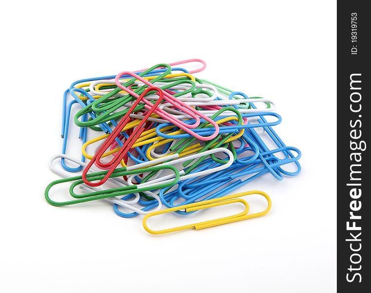 Many large paper clips on a white background. Colorful paper clips.