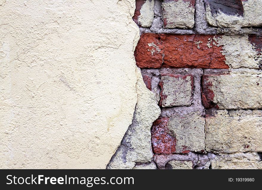 Old grunge stucco over brick wall - abstract background. Old grunge stucco over brick wall - abstract background