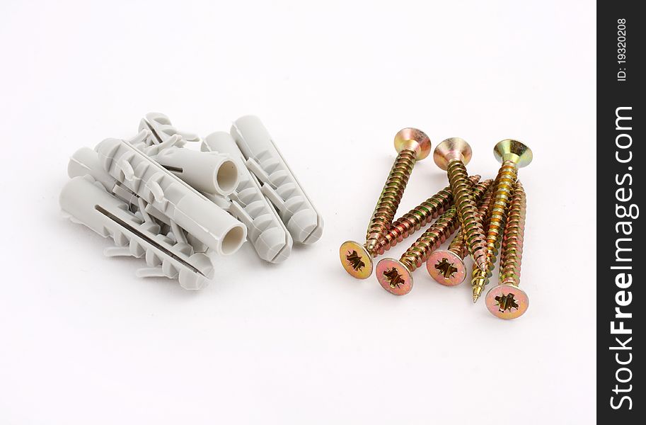 Dowels and screws on a white background