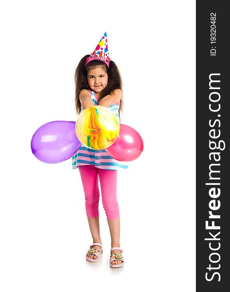 Little girl in birthday cap isolated on white