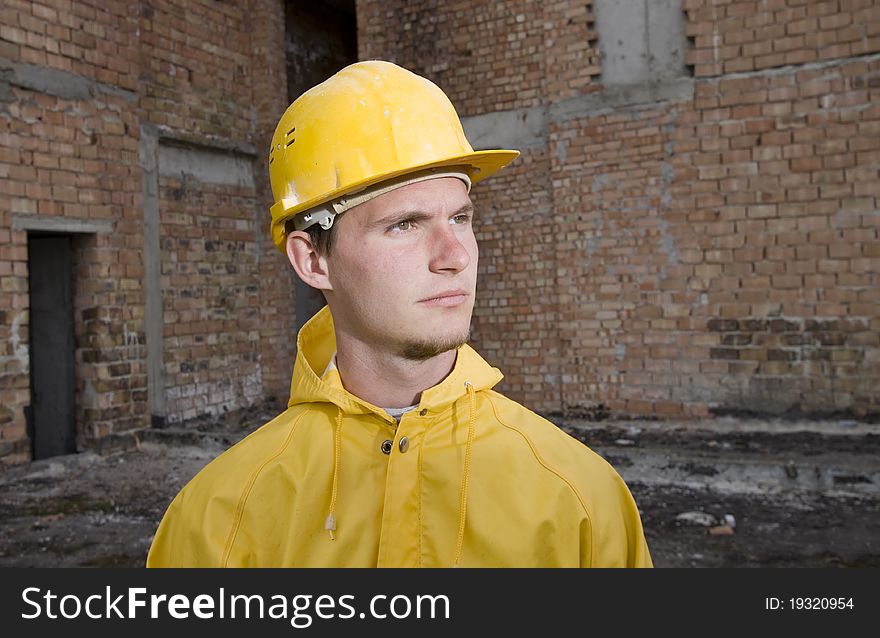Portrait of confident construction worker with helmet