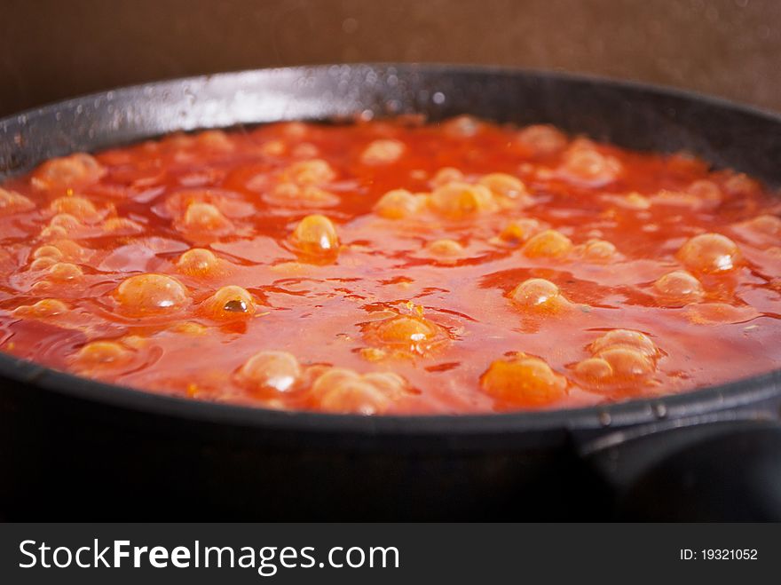 Tasty bolognese sause boiling in frying pan. Tasty bolognese sause boiling in frying pan