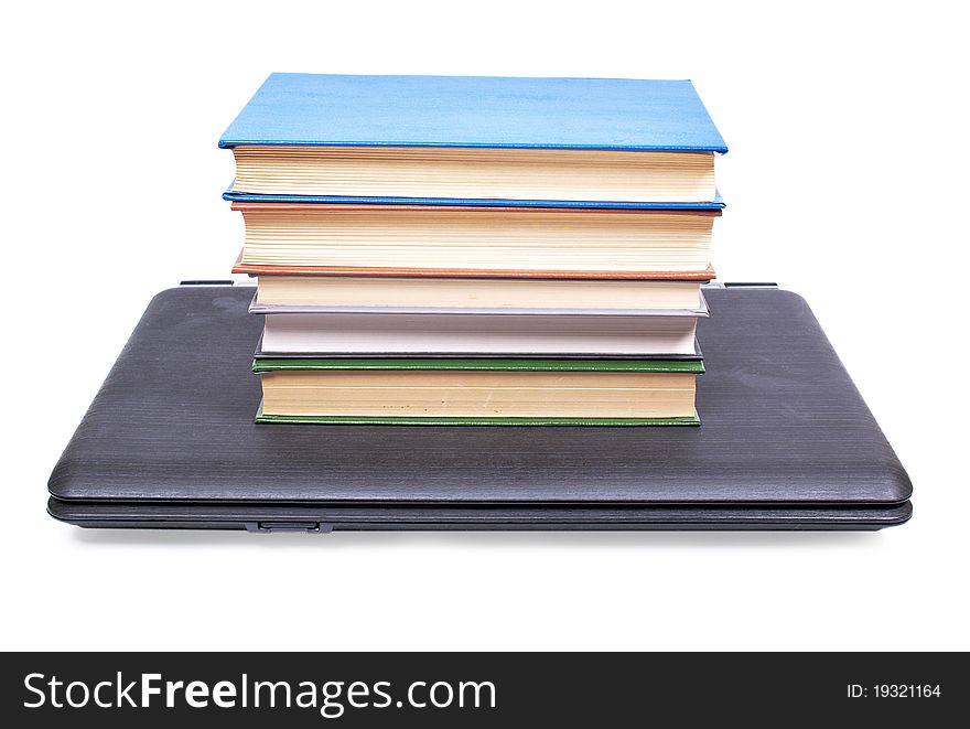 Color photo of an old book and computer. Color photo of an old book and computer