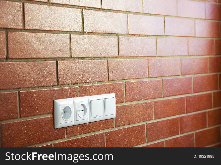 Power Outlets On The Brick Wall / Photo