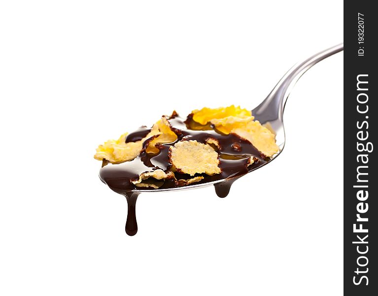 Spoon the corn flakes and chocolate, on a white background. Spoon the corn flakes and chocolate, on a white background.