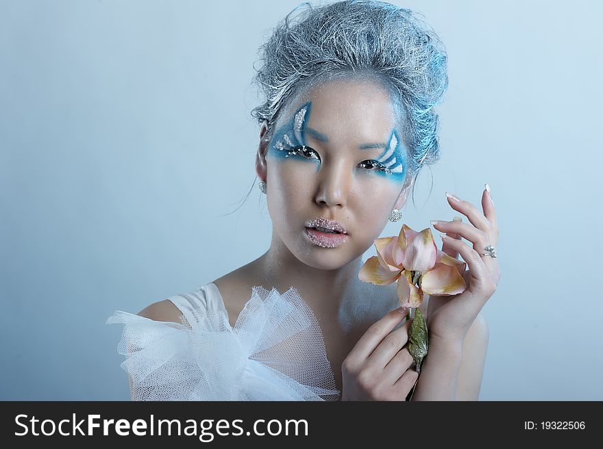 Portrait of woman with creative makeup and flower. Portrait of woman with creative makeup and flower