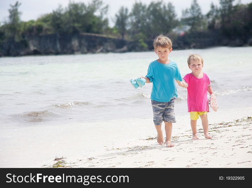 Children walking on beach