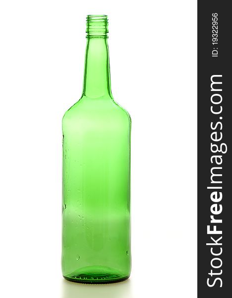 Green whiskey bottle against white