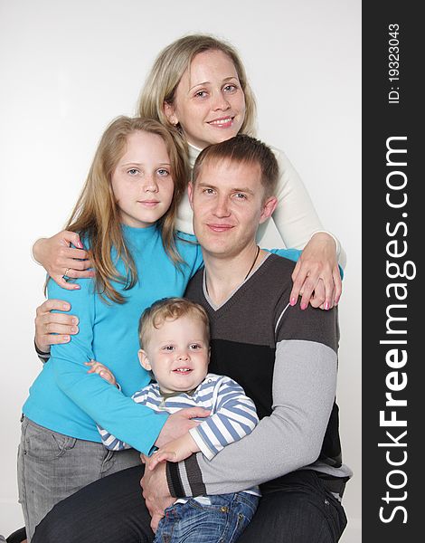 Studio family portrait over white