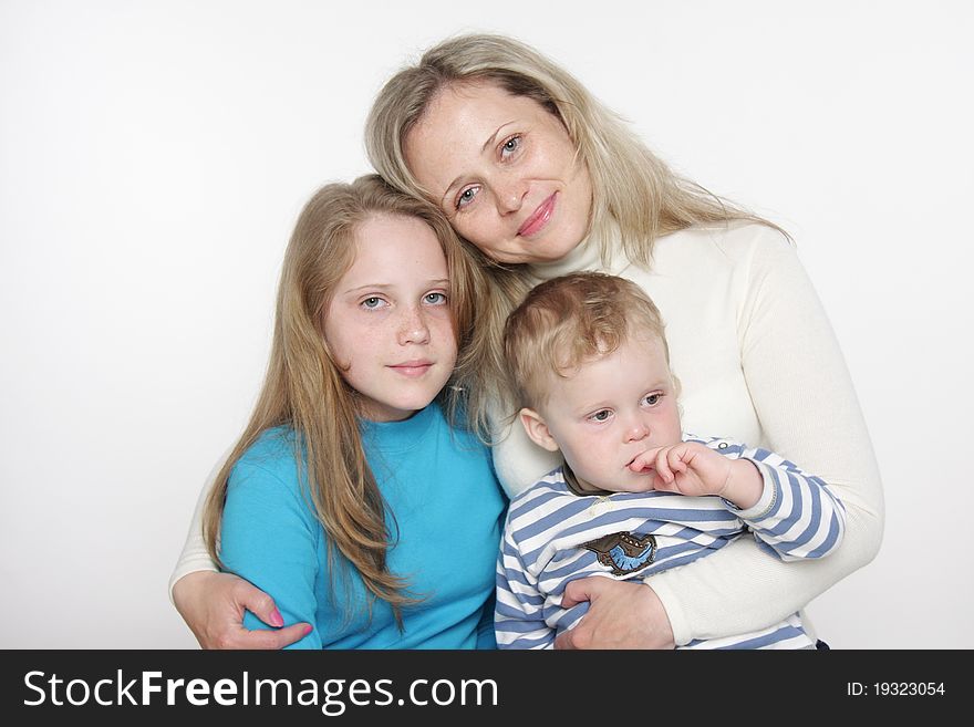 Mother and two children over white