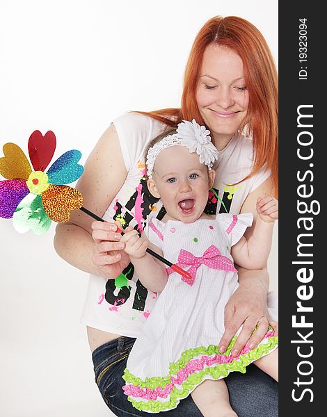 Happy mother and daughter with flower over white