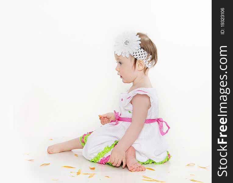 Cute toddler girl with flower over white. Cute toddler girl with flower over white