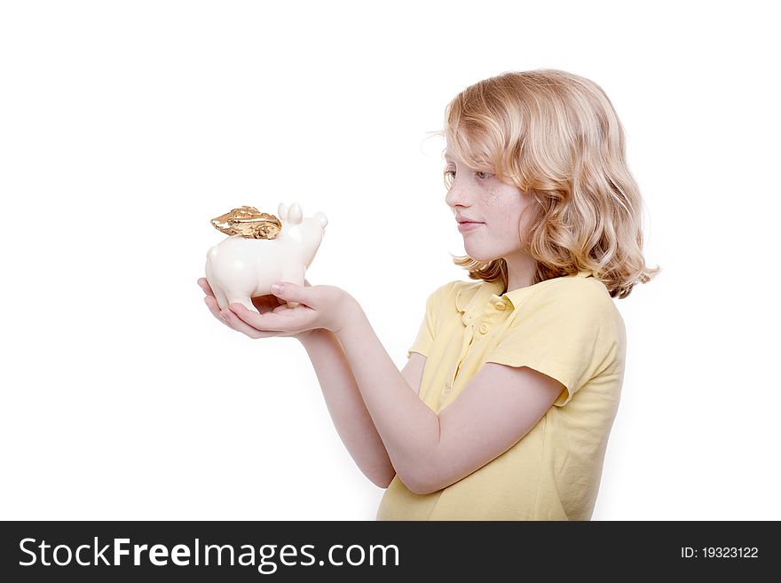 Small girl holds piggy bank in the hand. Small girl holds piggy bank in the hand