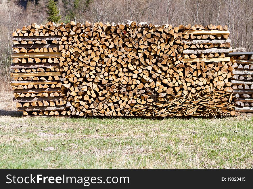 Logs stacked for fire in nature